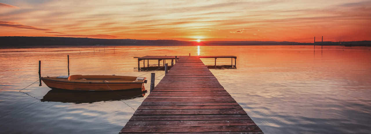 lake and jetty at sunset